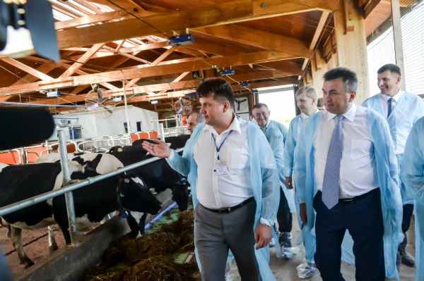 Vladimir Miklushevsky taking a tour of one of the farms in Primorye.