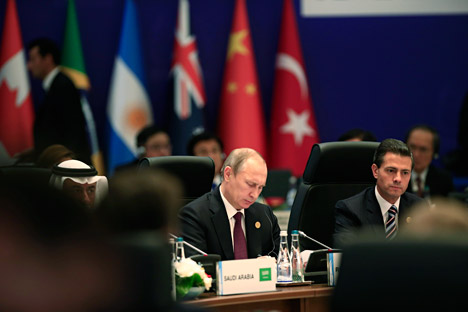 Russian President Vladimir Putin participates at a session of the G-20 summit, in Antalya, Turkey, Sunday, Nov. 15, 2015. 