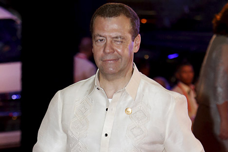 Russia's Prime Minister Dmitry Medvedev winks as he arrives in a traditional Philippine "barong" shirt for a welcome dinner during the Asia-Pacific Economic Cooperation (APEC) summit in the capital city of Manila, Philippines November 18, 2015.