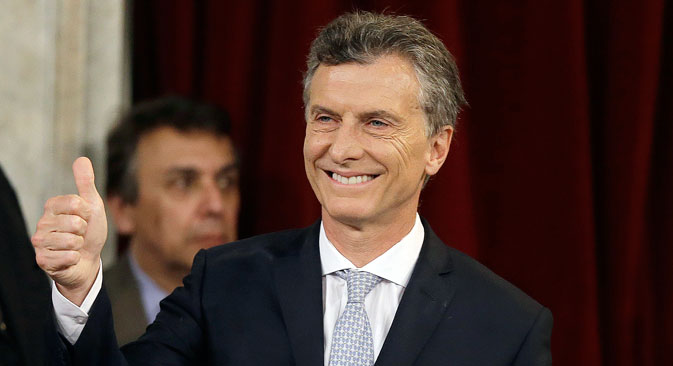 Mauricio Macri gives a thumbs up after being sworn in as new president at the Congress in Buenos Aires, Argentina, Thursday, Dec. 10, 2015. Macri was sworn in, inheriting myriad economic problems from the often divisive outgoing President Cristina Fernandez, who skipped the inauguration in a final sign of defiance that underscored deep polarization in the South American nation.