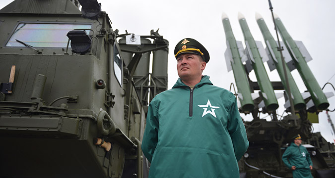 Serviceman in front of the anti-missile S-300 system at the ceremony of opening the ARMY-2015 international forum in the military park Patriot, in the town of Kubinka, Moscow Region, June 16, 2015.