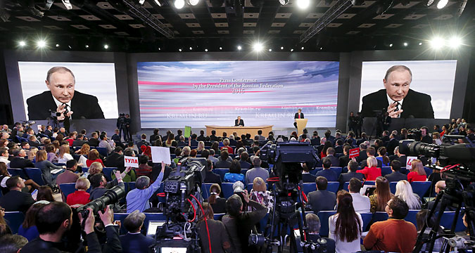 Journalists listen to Russian President Vladimir Putin during his annual end-of-year news conference in Moscow, Russia, December 17, 2015. 