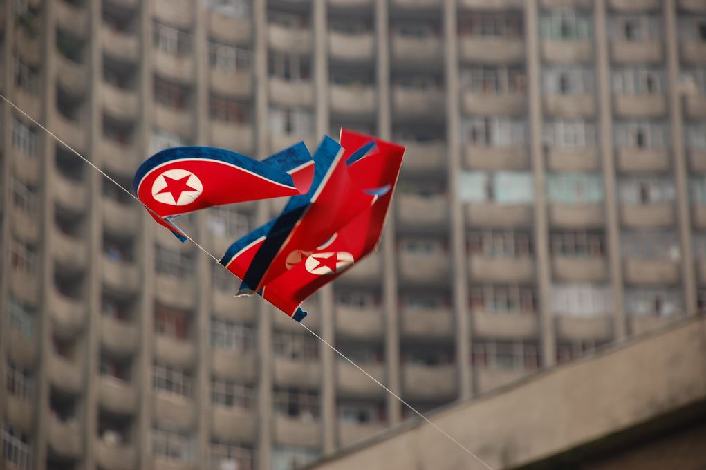 The flag of the Democratic People's Republic of Korea on a building in Pyongyang.