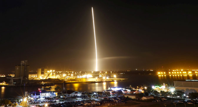 The first stage of the SpaceX Falcon 9 rocket returns to land in a time exposure at Cape Canaveral Air Force Station, on the launcher's first mission since a June failure, in Cape Canaveral, Dec. 21, 2015. 