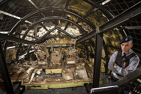 A military policeman stands guard in the cockpit of the MH17 airplane after the presentation of the final report into the crash of July 2014 of Malaysia Airlines flight MH17 over Ukraine, in Gilze Rijen, the Netherlands, October 13, 2015. 