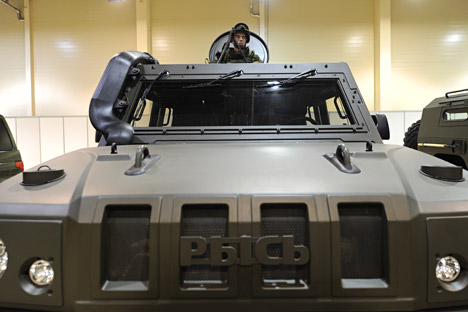 A serviceman in a light multirole armoured vehicle Lynx.