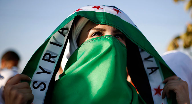 Mujer siria que apoya a la oposición.