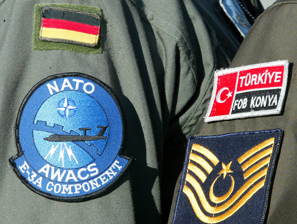 A Turkish NATO MP guards together with a German crew member one of three AWACS planes, based at the Forward Operation Base in Konya, Turkey. 