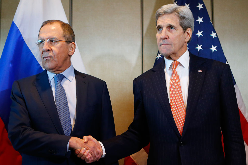 Russian Foreign Minister Sergey Lavrov, left, and U.S. Secretary of State John Kerry shake hands prior to bilateral talks in Munich, Germany.