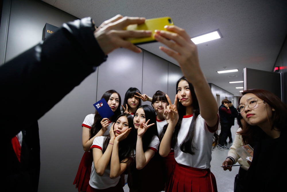 Members of South Korean girl group GFriend take a 'selfie' after their performance in "The Show" in Seoul January 20, 2015. 