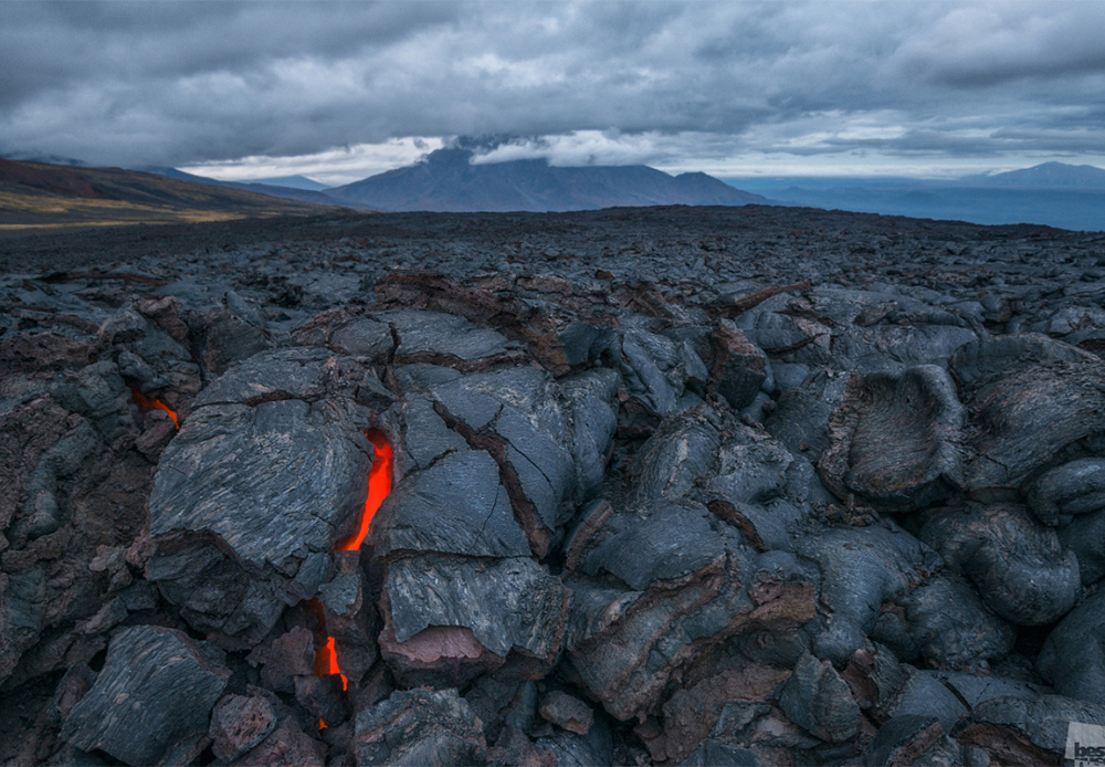Volcanic lava cooling down in the cracks of the ground at the Tolbachik volcano complex, Kamchatka Peninsula.