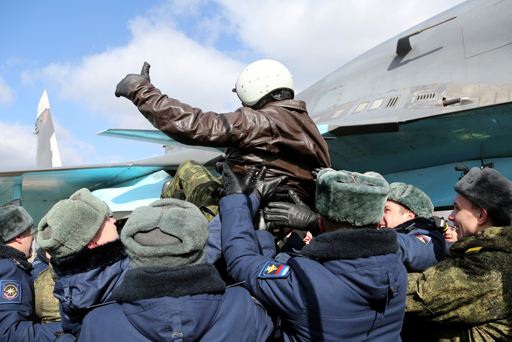 A Russian pilot receives a hero's welcome on returning from Syria at an airbase near the Russian city of Voronezh, March 15, 2016. 