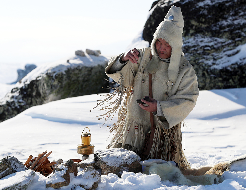 YAKUTIA, RUSSIA. MARCH 29, 2016. A shaman seen during a ceremony to light the 2016 Children of Asia International Sports Games torch on Mount Kisilyakh, a sacred place for the Yakuts. The relay covering more than 35,000 km (21,748 miles) will pass through 194 Yakut localities. The 6th Children of Asia International Sports Games will be held in the Sakha Republic (Yakutia) on July 6-17, 2016. 3,500 young athletes will take part in the competition.