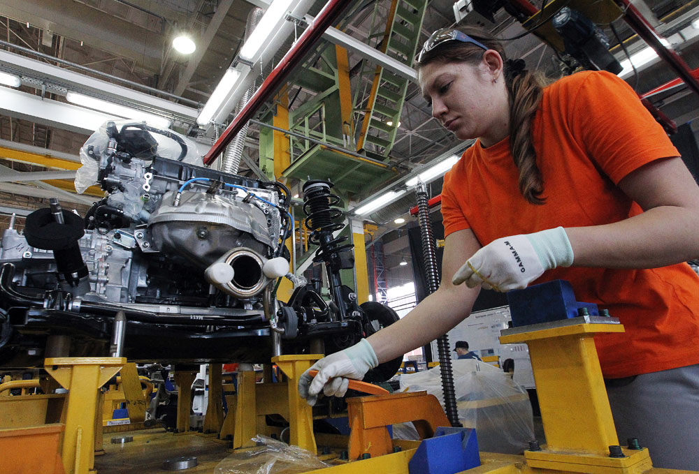 An employee works at the Mazda 6 automobile assembly line at Mazda Sollers Manufacturing Rus auto plant in Vladivostok.