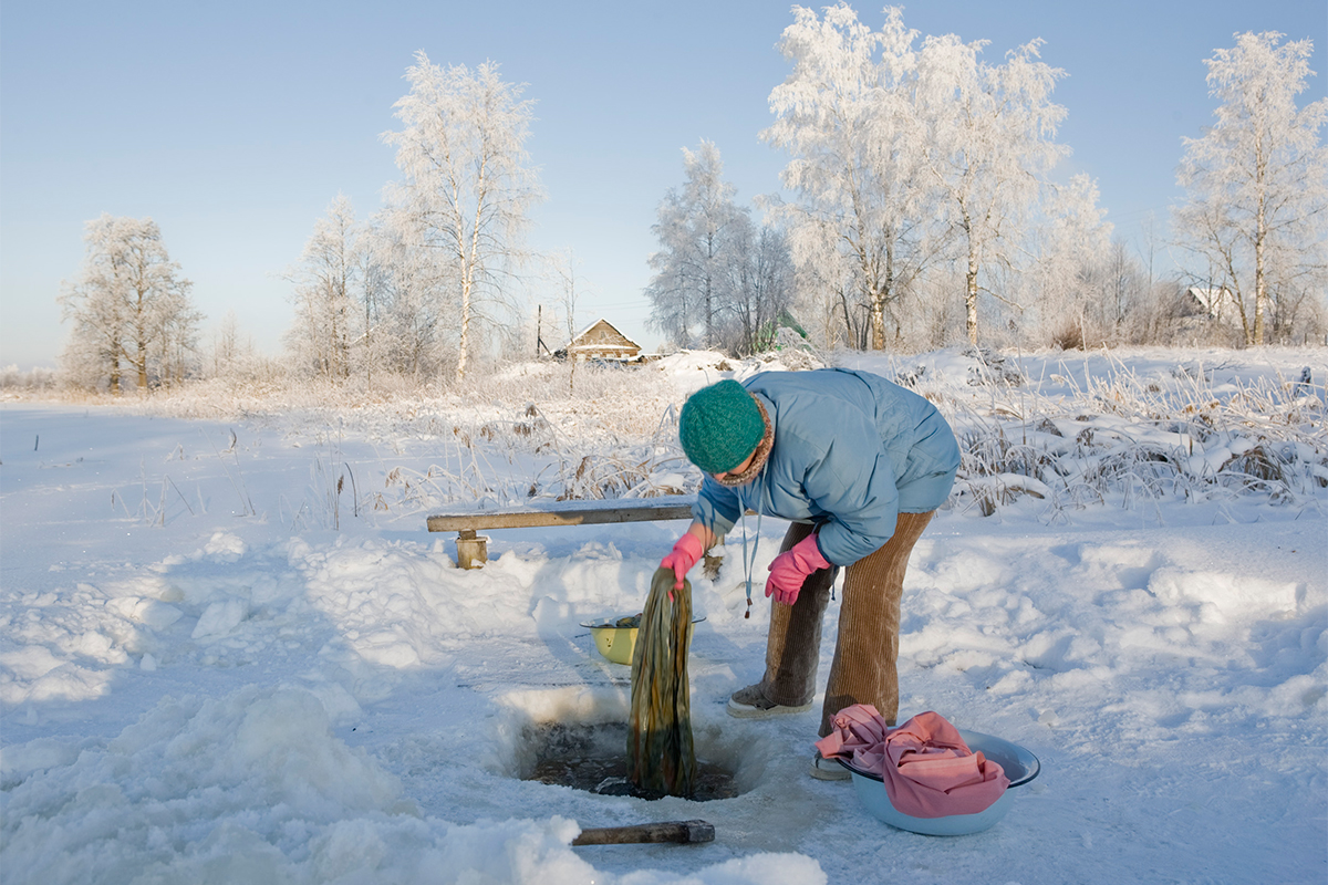 In winter inhabitants of the village make a hole in the ice and wash their linen in the icy water.