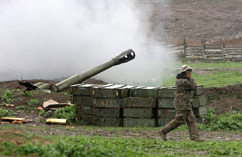 A howitzer fires at an artillery position of the self-defense army of Nagorno-Karabakh near Martakert, April 3, 2016. 