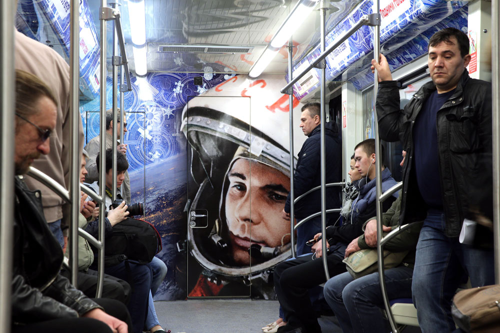 Commuters in a space themed train at Polezhayevskaya station of the Moscow Metro. The train was launched to mark the 55th anniversary of the first manned space flight by cosmonaut Yuri Gagarin. On April 12, 1961, Gagarin became the first man in space when he orbited the Earth aboard Vostok 1