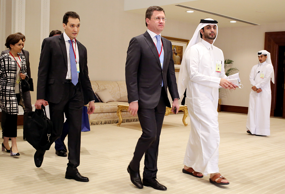 Russian Energy Minister Alexander Novak, center, arrives at an oil-producers' meeting in Doha, Qatar, on Sunday, April 17, 2016.