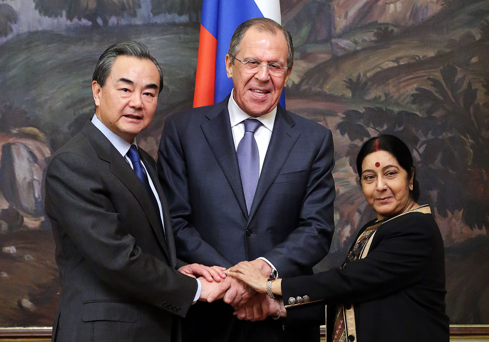 China's Foreign Minister Wang Yi, Russia's Foreign Minister Sergei Lavrov, and India's Foreign Minister Sushma Swaraj (L-R) ahead of the 14th Russia-India-China (RIC) meeting of foreign ministers.