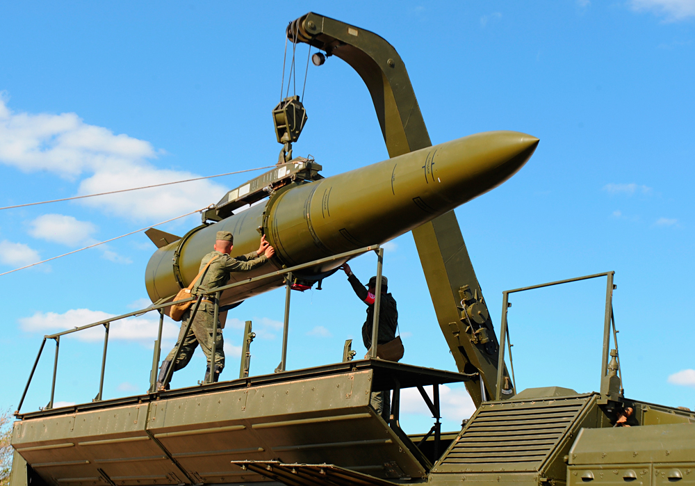 A rocket being loaded into an Iskander-M missile launcher.