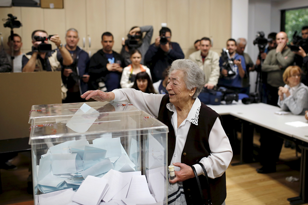 A woman casts her vote at a polling station during elections in Belgrade, Serbia April 24, 2016