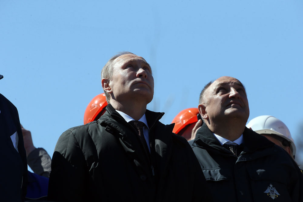 Russian President Vladimir Putuin watches the first launch from the Vostochny Cosmodrome.
