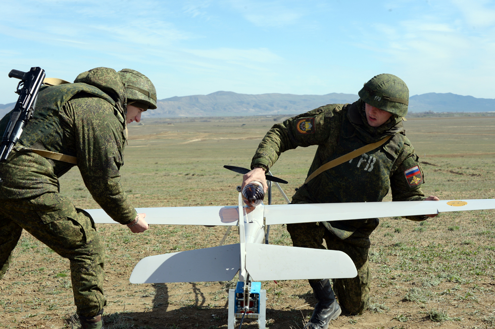 Servicemen prepare a drone for launch during a drill of the Southern Military District troops.