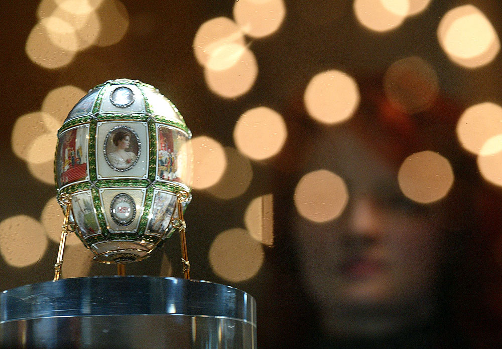 A visitor admires the Egg by Faberge, presented by the Russian Czar Nikolas II to his wife in 1911, during an exhibition in the Kremlin in Moscow.