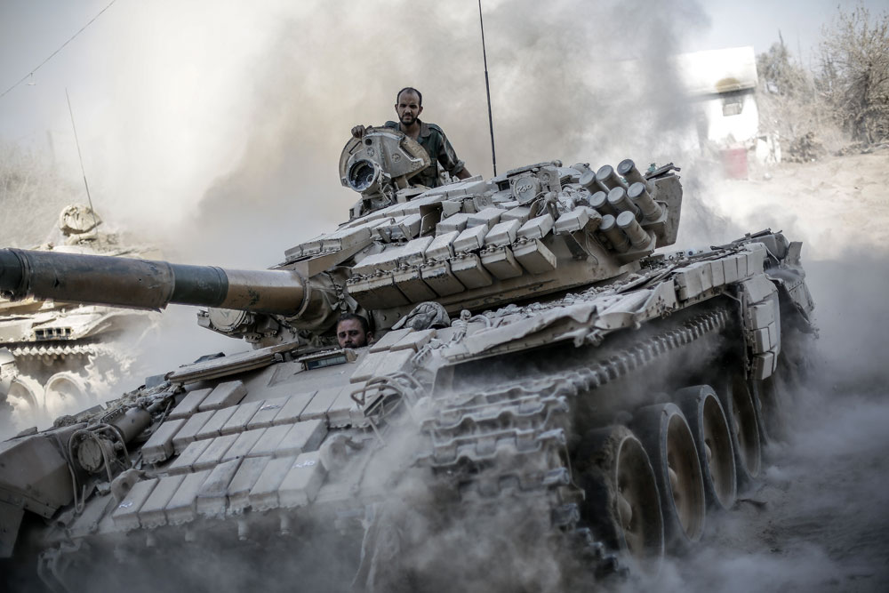 Tthe T-72 tank will be fitted with reactive armor tiles on all sides. Pictured: Syrian Army soldiers fight insurgents in Jobbar, a suburb of Damascus. Source: Andrey Stenin / RIA Novosti