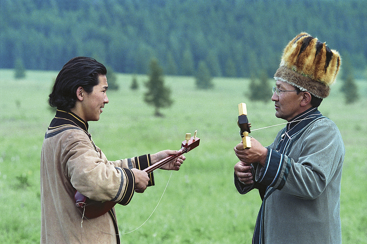 A teacher and his student playing the topshur, Altai’s national string instrument (a two-stringed lute).