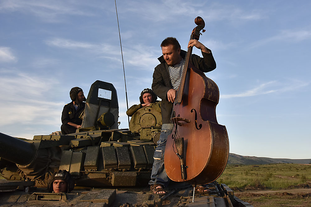 A musician plays a double-bass during a patriotic festival, "Chronicles of Crimea. Episode 2016: What Fatherland Starts With?", held at the Angarsky training field in Zarechnoye settlement, Crimea.