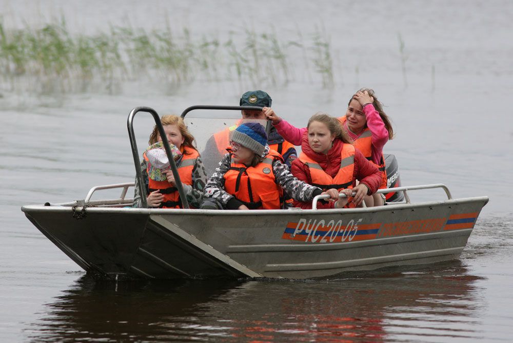  KARELIA, RUSSIA – JUNE 19, 2016: Kids return to the Syamozero Park Hotel in the Pryazhinsky District. At least 10 children from Moscow and one adult died in the early hours of June 19 as storm hit a tourist boat on Lake Syamozero. 