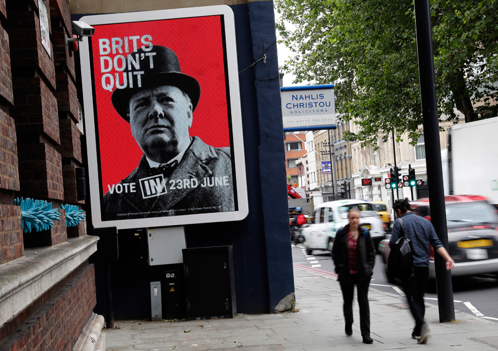 "There is a sense in the Kremlin that Brexit would ultimately be good for Russia’s overall geopolitical positioning." Photo: Pedestrians walk past a "Vote Remain" campaign electronic billboard in London, June 22, 2016