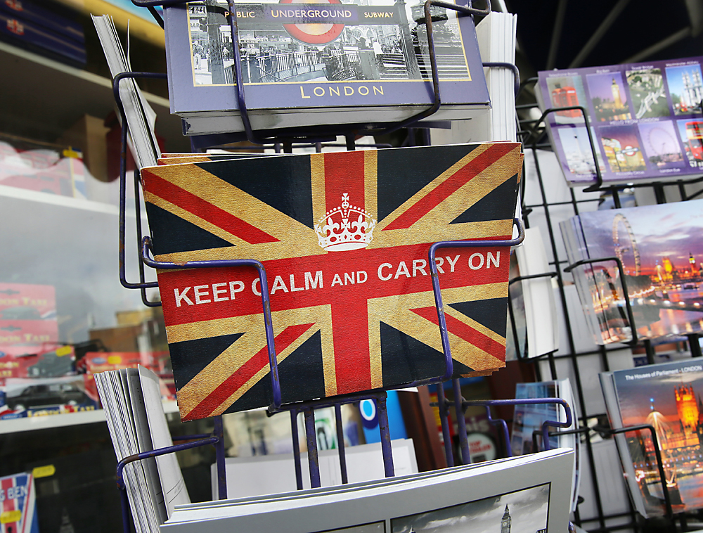 A postcard reads 'Keep calm and carry on' in London, Britain, 24 June 2016. In a referendum on 23 June, Britons have voted by a narrow margin to leave the European Union (EU)