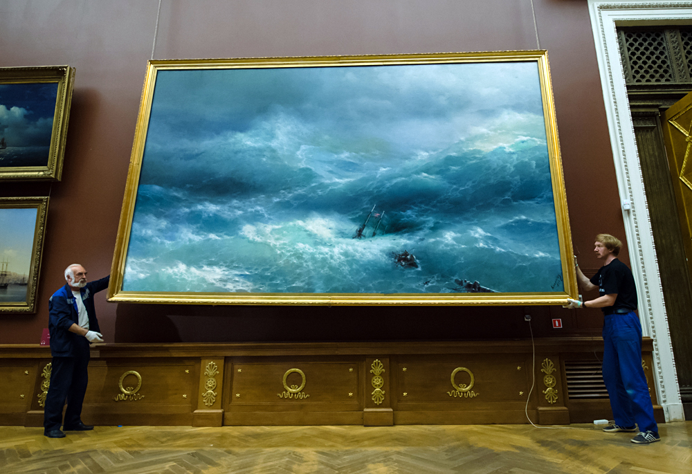 Employees of the Russian Museum in St. Petersburg pack up the works of Ivan Aivazovsky for delivery to the Tretyakov Gallery.