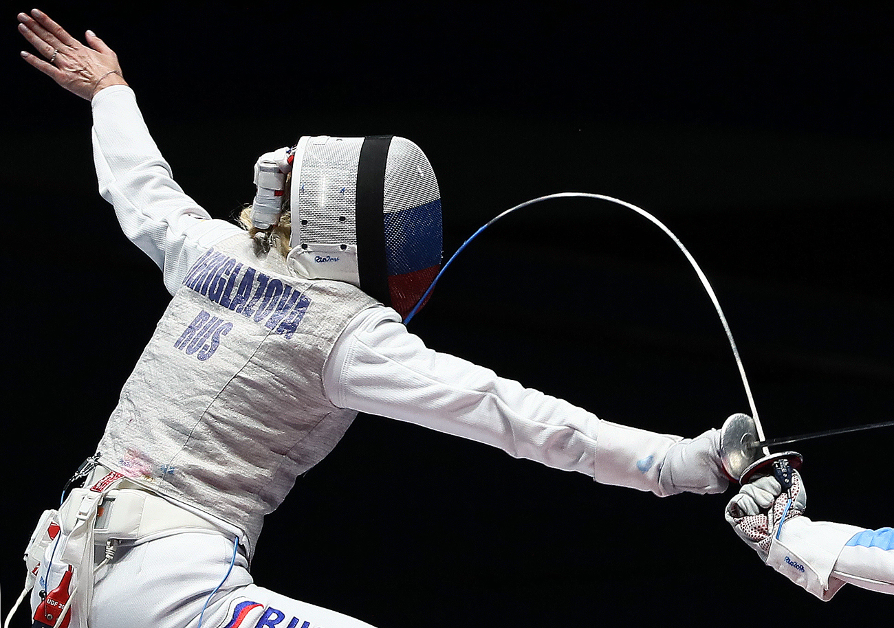Inna Deriglazova of Russia in action against Elisa di Francisca of Italy during the women's Foil individual gold medal bout of the Rio 2016 Olympic Games Fencing events at the Carioca Arena 3 in the Olympic Park in Rio de Janeiro, Brazil