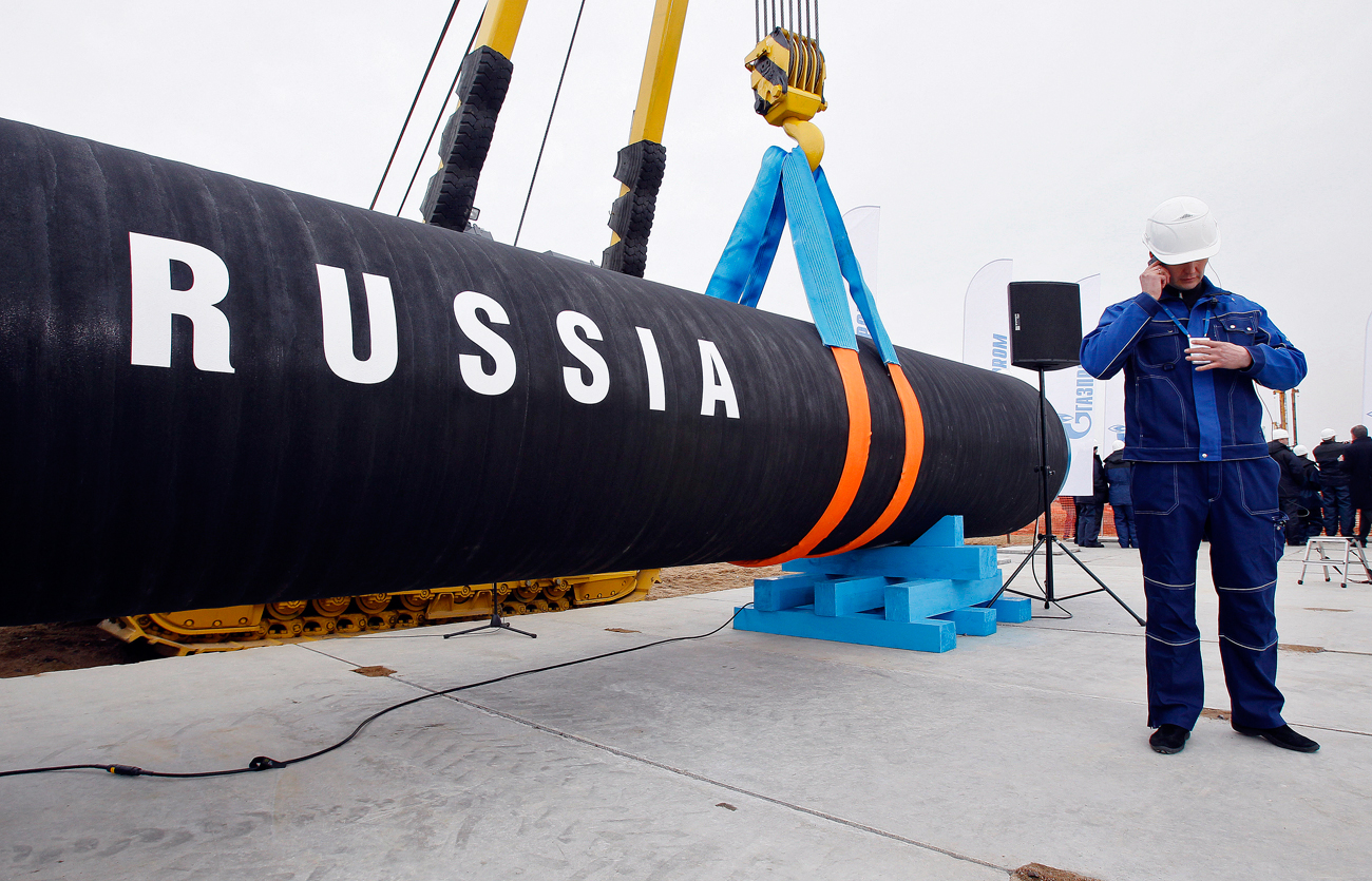 A construction worker speaks on a mobile phone in Portovaya Bay some 170 kms (106 miles) north-west from St. Petersburg, Russia, during a ceremony marking the start of Nord Stream pipeline construction.