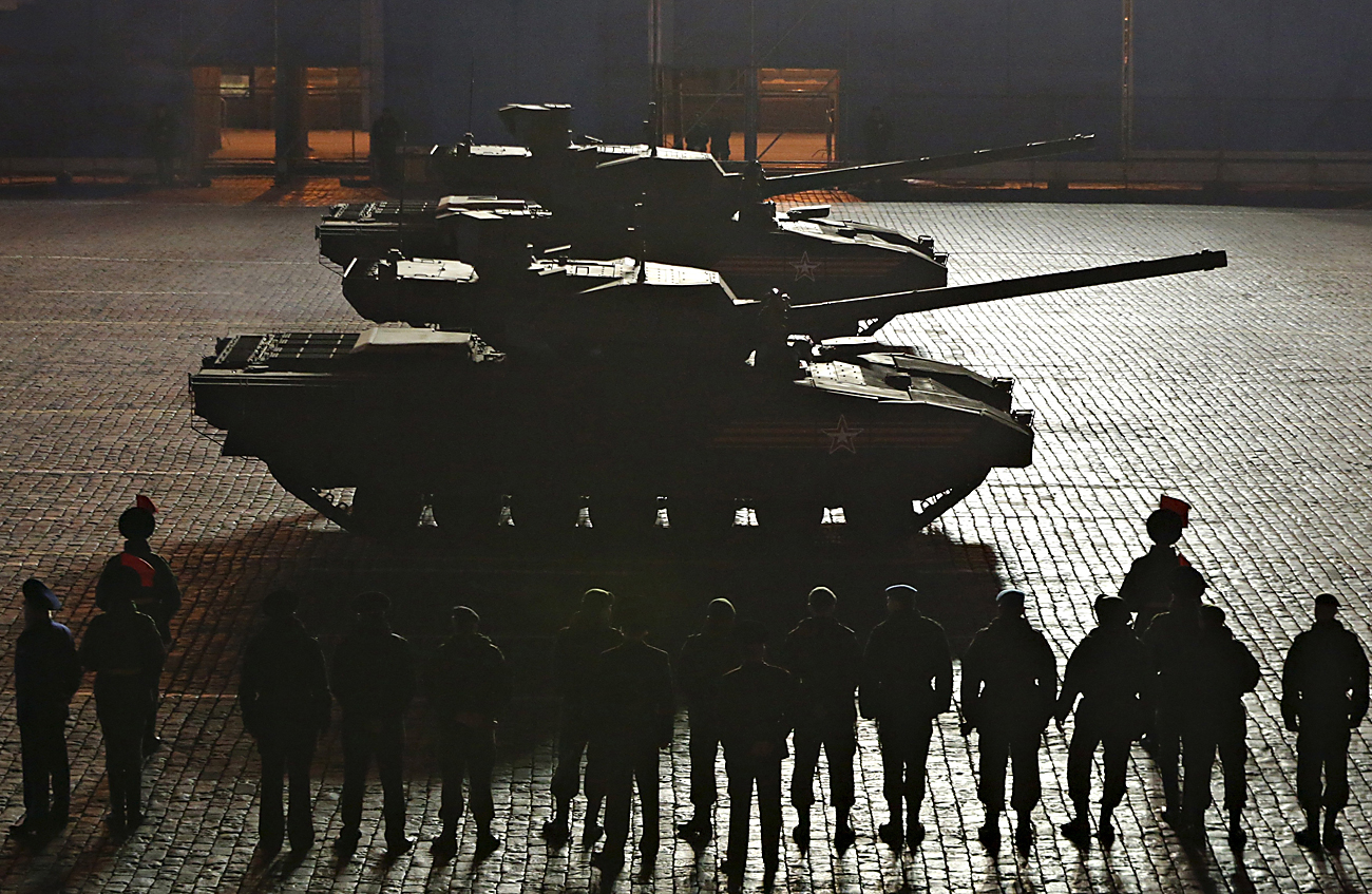 Russian Armata tanks drive during a rehearsal for the Victory parade on Moscow's Red Square, May 4, 2015. 