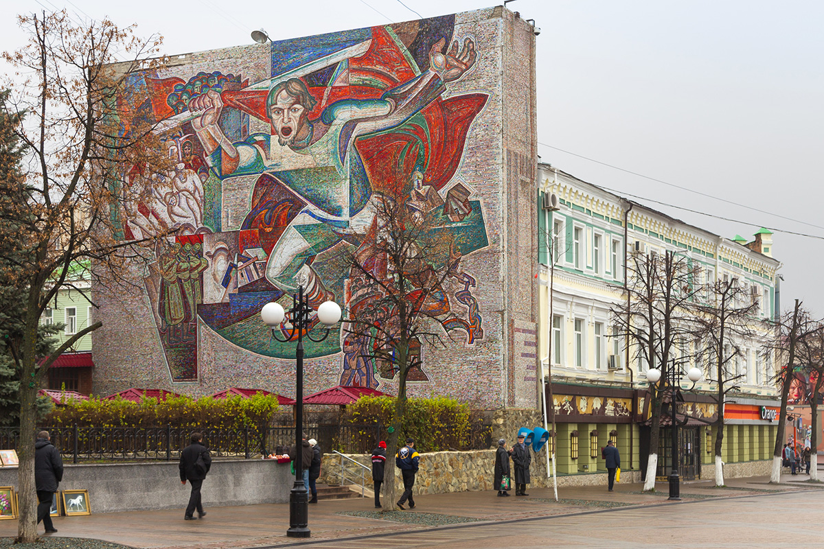 Mosaic of a worker fighting for Communism and bearing a red flag. Penza city.