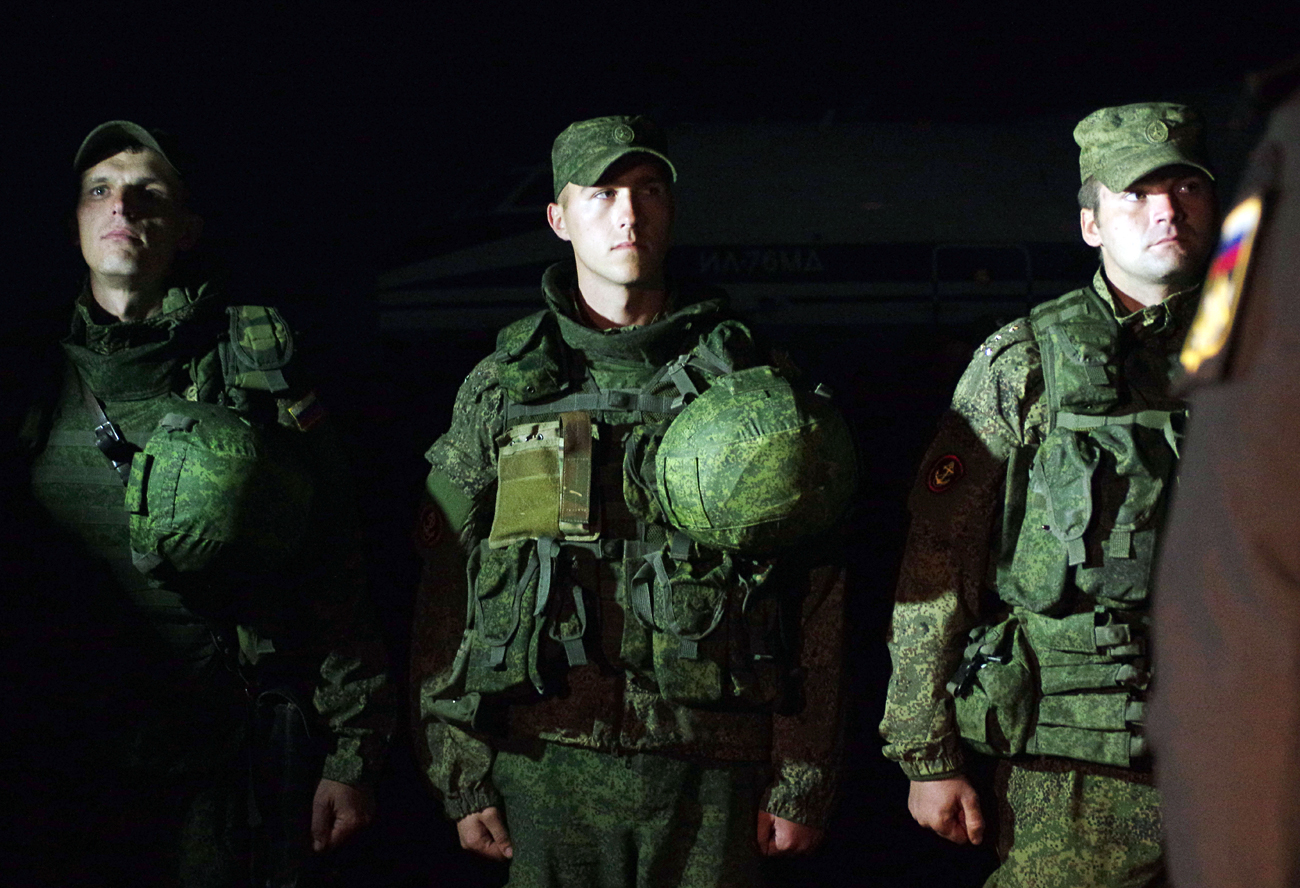 Russia’s Black Sea Fleet marines who arrived after a successful operation guarding the Hmeymim airbase in Syria, on the Belbek airfield near Sevastopol.