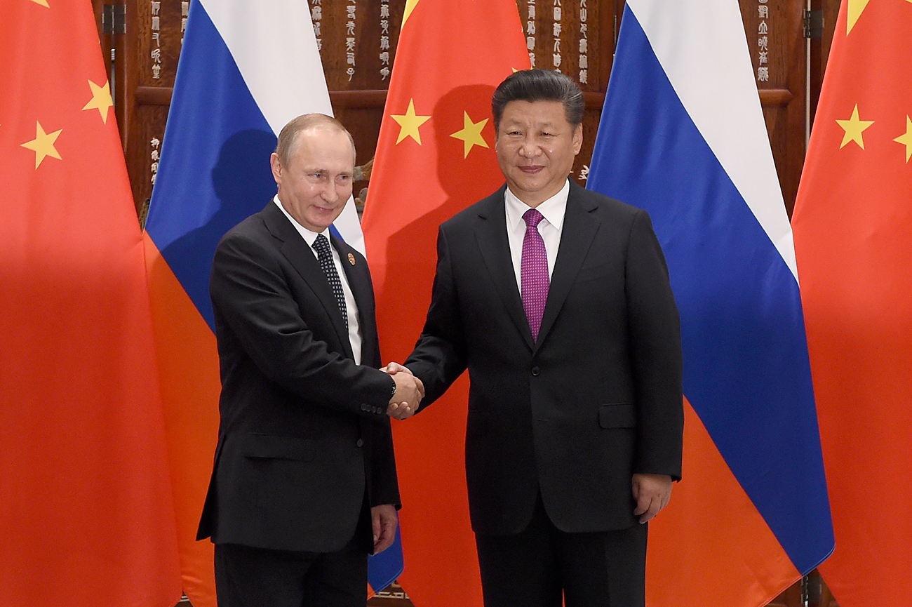 Chinese President Xi Jinping shakes hands with Russian President Vladimir Putin ahead of G20 Summit in Hangzhou, China, in September 2016.
