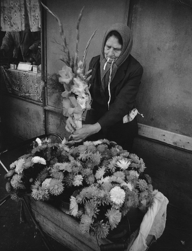 Although these days people can buy anything they want, old habits die hard, especially Soviet ones. The previous year Muscovites stood in line for Valentin Serov exhibition, the latest iPhone or Kanye West sneakers. You can still see grannies or “babushkas” lined up outside the subway or bus stops selling homegrown flowers and vegetables, or homemade jam. / Selling flowers for September 1, Gorki settlement. The photos were on display at the exhibition "A consumer's dream" in Multimedia Art Museum, Moscow. 