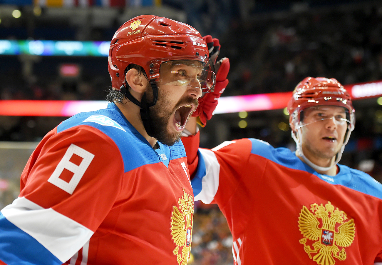 Team Russia forward Alex Ovechkin (8) celebrates with forward Evgeny Kuznetsov (92) after setting up a goal by teammate Vladimir Tarasenko (not pictured) against Team Finland during preliminary round play in the 2016 World Cup of Hockey at the Air Canada Centre in Toronto, Ontario, Canada.