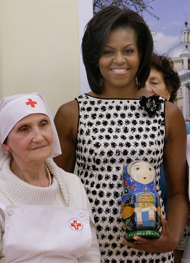 A Matryoshka is a wooden doll containing several smaller dolls. The number of dolls inside varies. There are expensive Matryoshkas with hundreds, while an ordinary one has from 2 to 10. / Michelle Obama during her visit at the St. Dimitry nurse training college in Moscow, Russia, 2009.