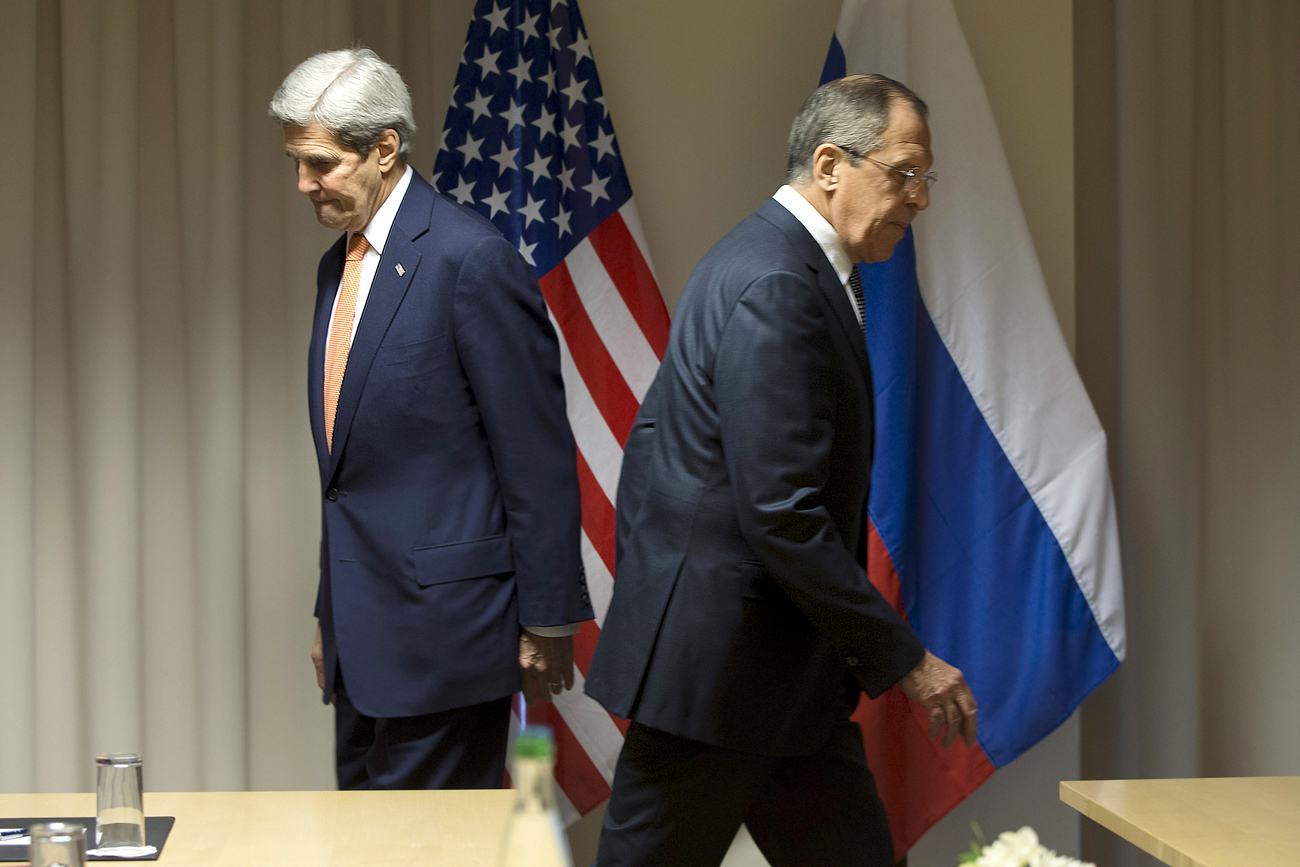 U.S. Secretary of State John Kerry and Russian Foreign Minister Sergey Lavrov walk to their seats for a meeting about Syria, in Zurich, Switzerland, Jan. 20, 2016.