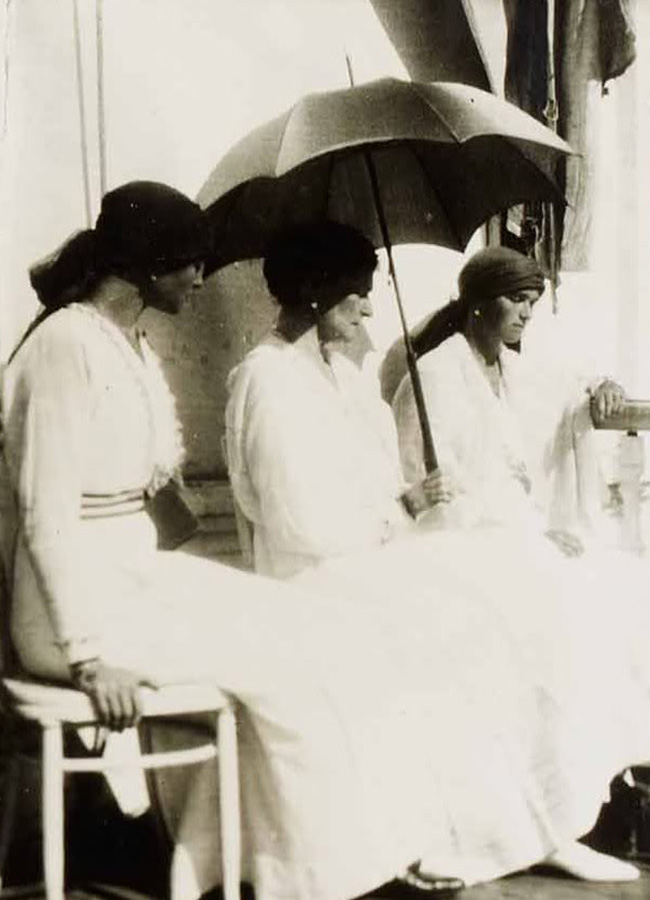 The Last Russian Emperor of the Romanov dynasty, Nicholas II, his wife Alexandra, daughters Maria, Olga, Tatiana and Anastasia, and son Alexei were killed by the Bolsheviks in Yekaterinburg on the night of July 16-17, 1918 and later were canonized as saints. / The last photograph ever taken of Empress Alexandra Feodorovna in the company of her daughters Olga (right) and Tatiana (left), Tobolsk, Siberia, 1918.