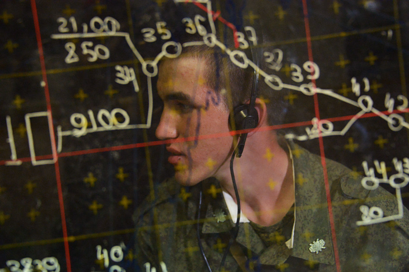 A serviceman at the command headquarters of the combat employment center during an Air Force and Air Defence Force tactical exercise at the Ashuluk firing range.