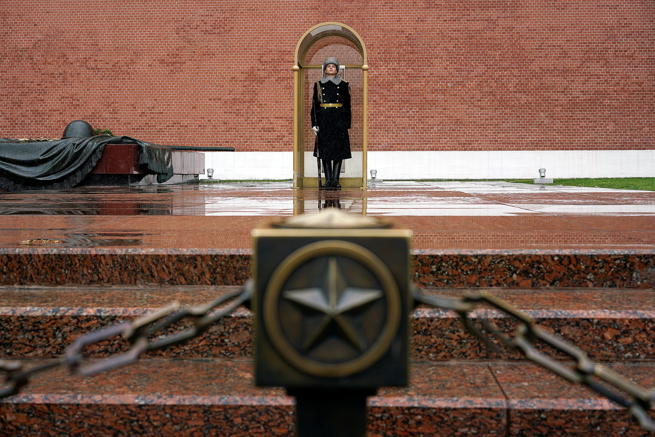 A honor guard stands at the Tomb of the Unknown Soldier by the Kremlin wall in central Moscow, Russia