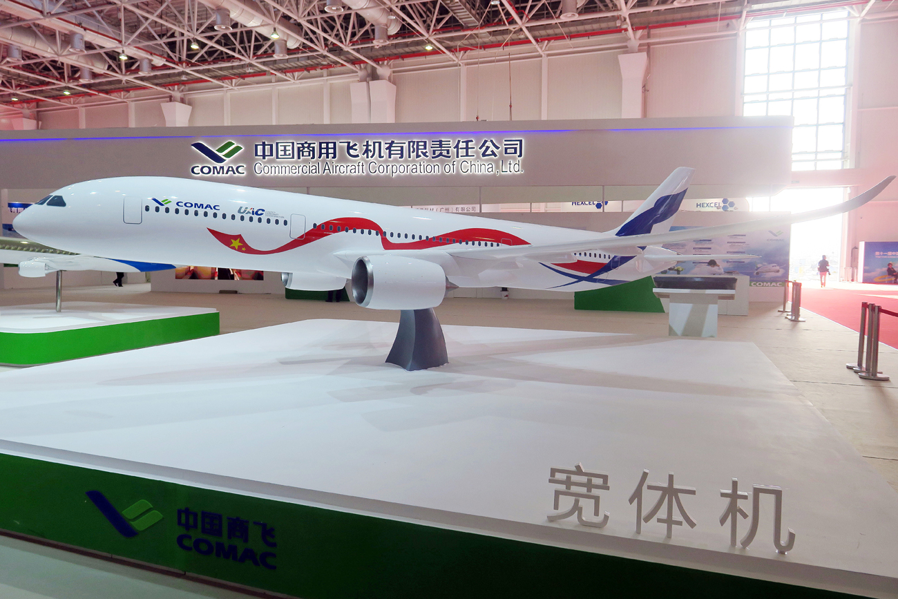 A model of a wide-body commercial jet being developed by China's COMAC (Commercial Aircraft Corp of China) and Russia's United Aircraft Corporation is on display during the 11th China International Aviation and Aerospace Exhibition, also known as Airshow China 2016.