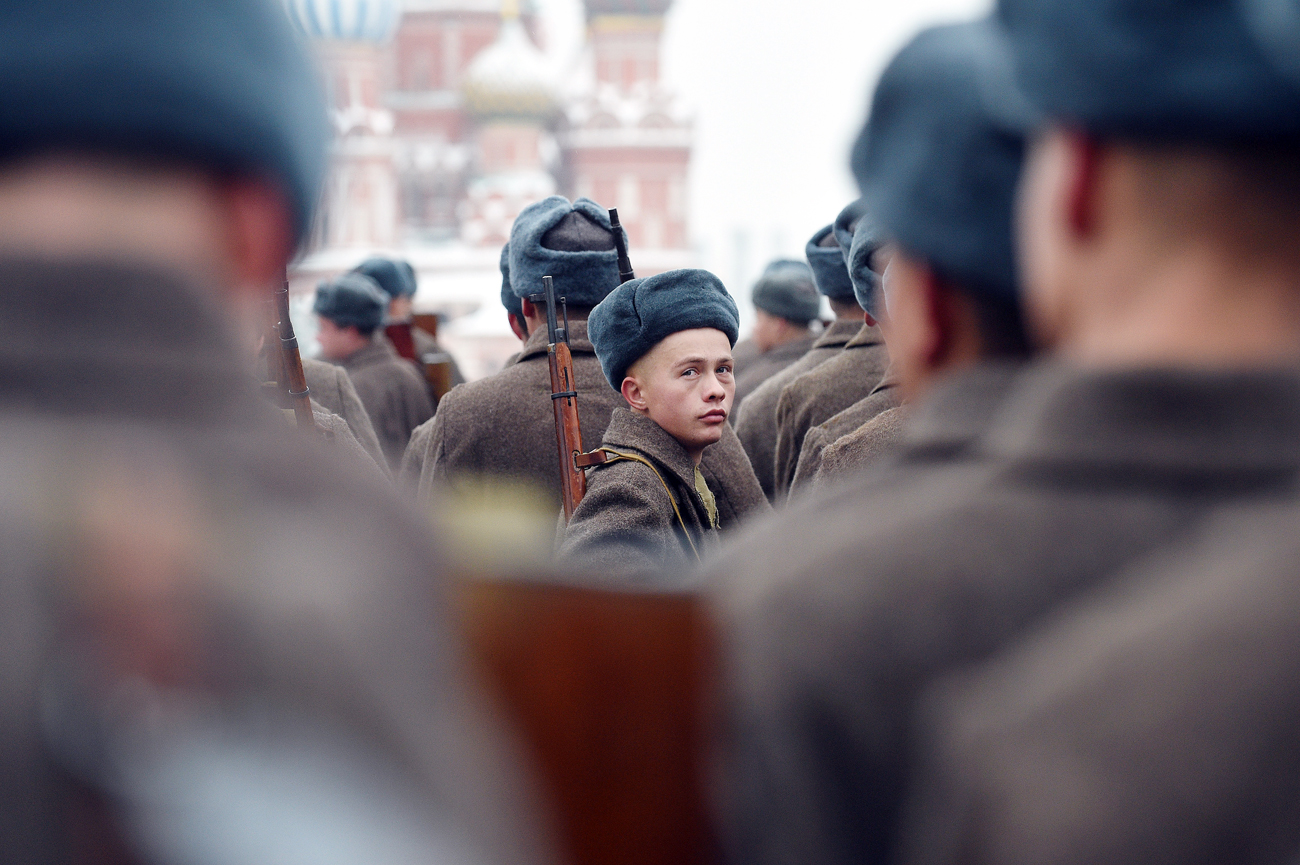 Russian servicemen dressed in historical uniforms get ready for the military parade at Red Square in Moscow on November 7, 2016. Russia marks the 75th anniversary of the 1941 historical parade, when Red Army soldiers marched past the Kremlin walls towards the front line to fight the Nazi Germany troops during World War Two